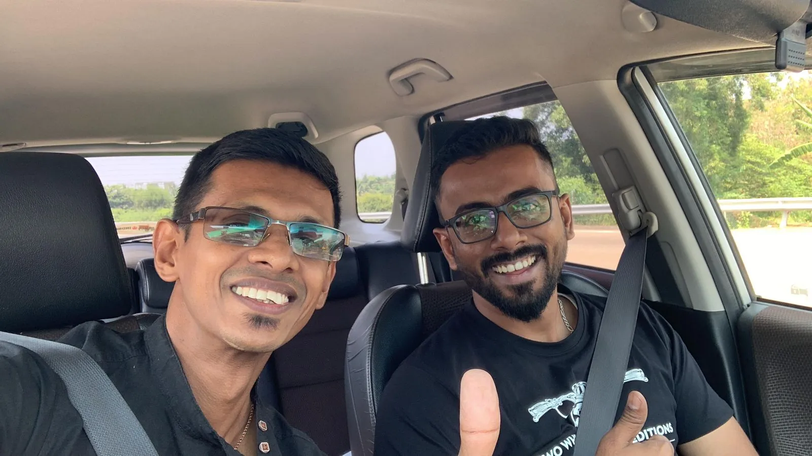 Colombo Airport Taxi drivers smiling on the highway